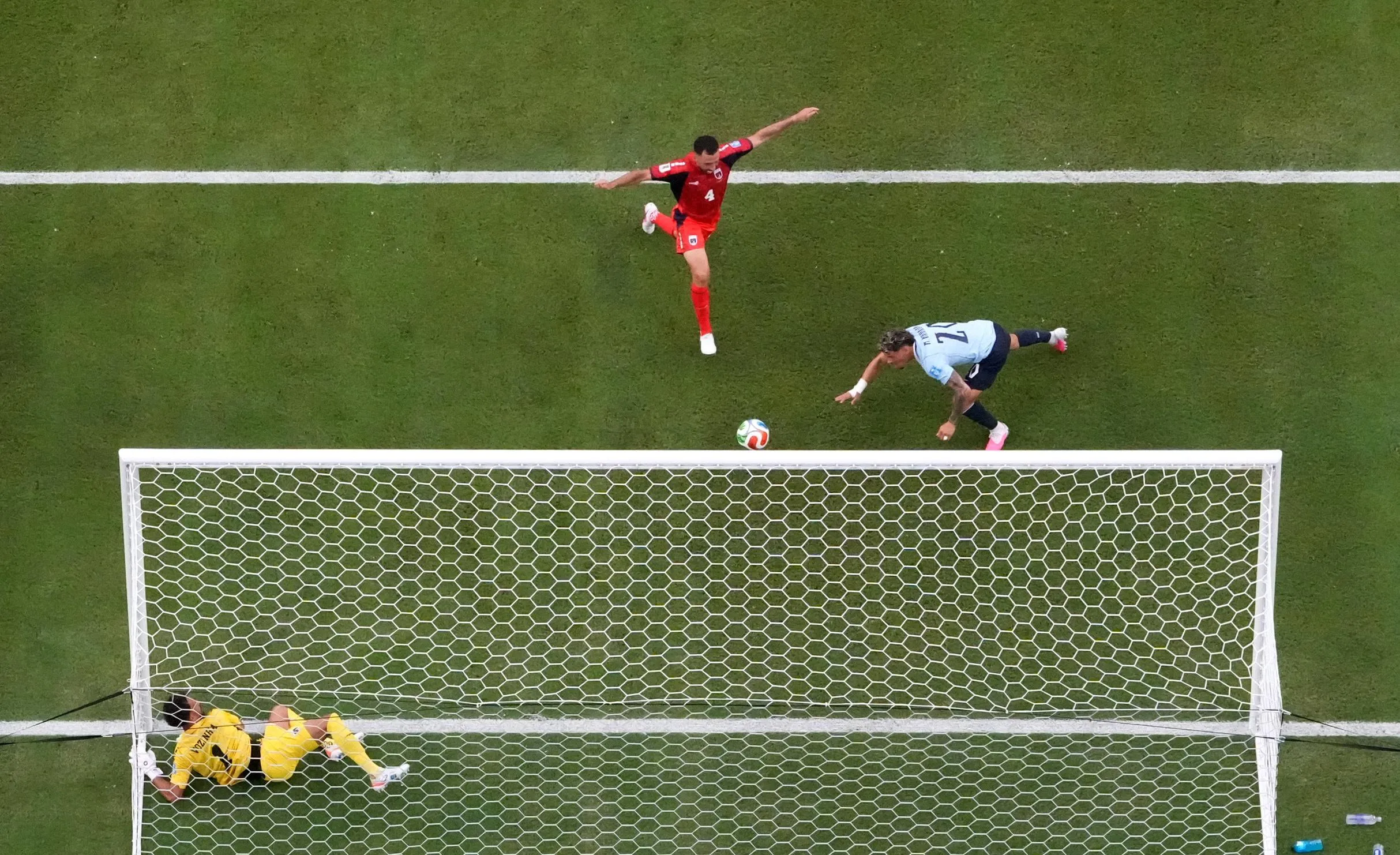 Uruguay's Maxi Araujo heads in the equaliser