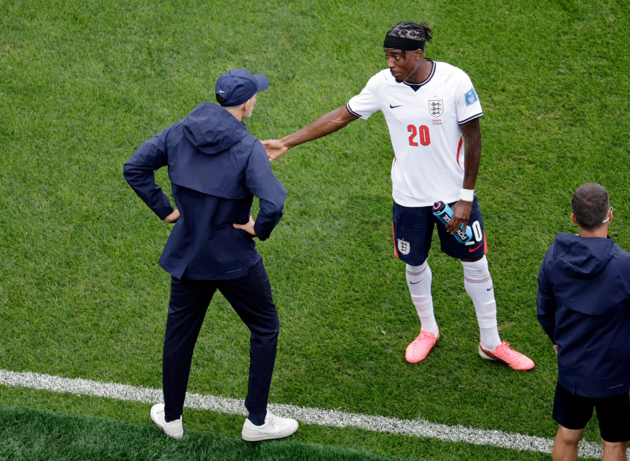 England head coach Thomas Tuchel and Noni Madueke in conversation on the touchline