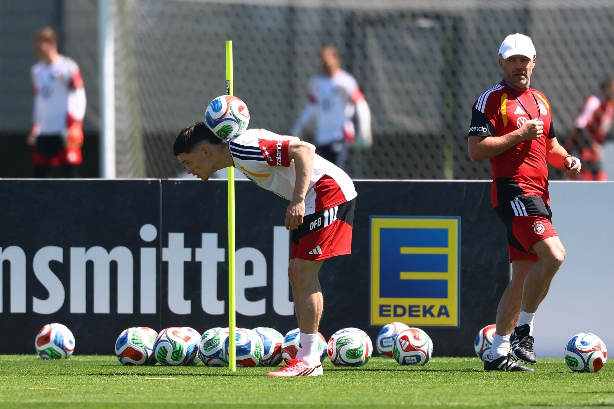 Germany’s Florian Wirtz balances a ball on the back of his neck during training