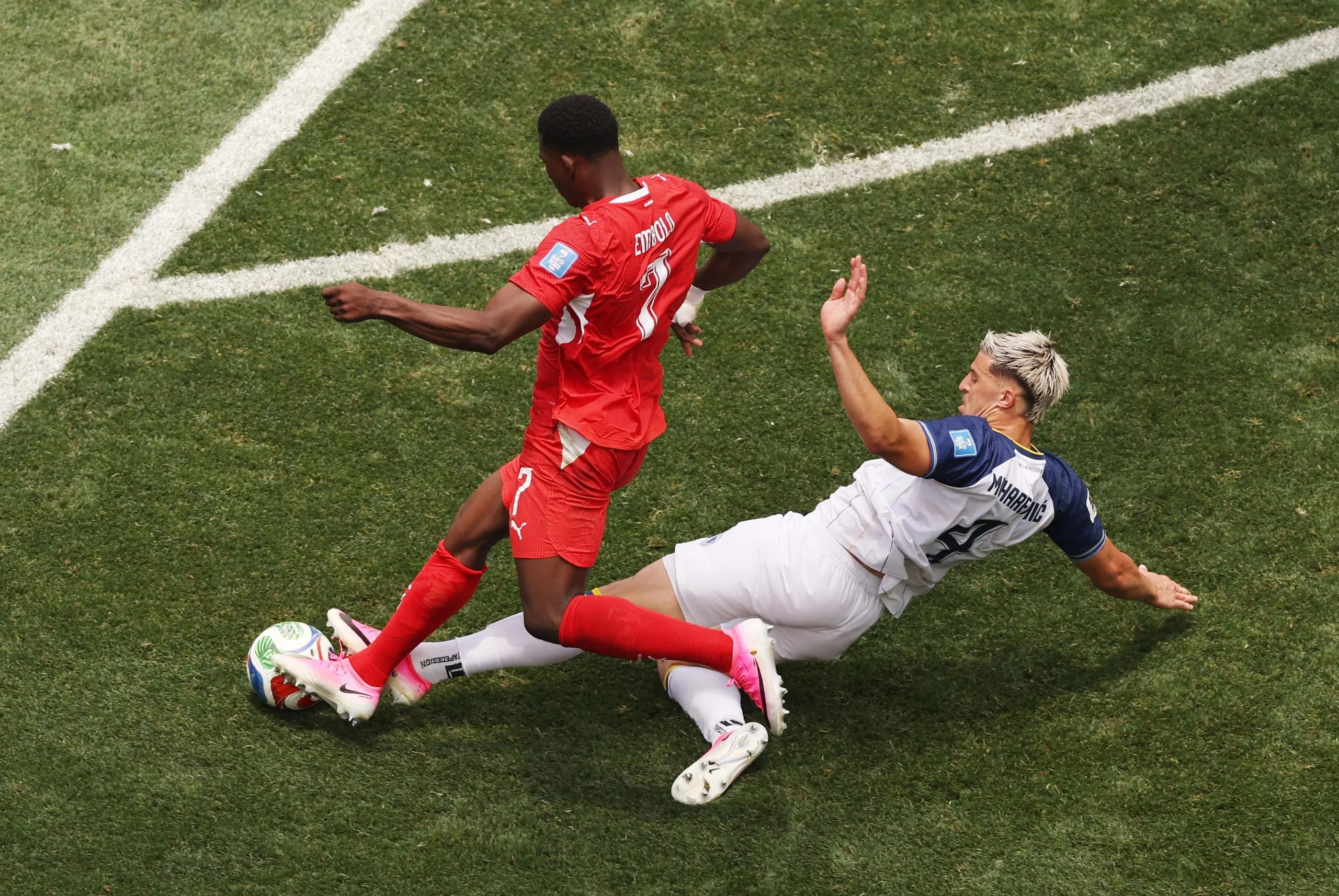 Tarik Muharemovic brings down Switzerland’s Breel Embolo on the edge of the box