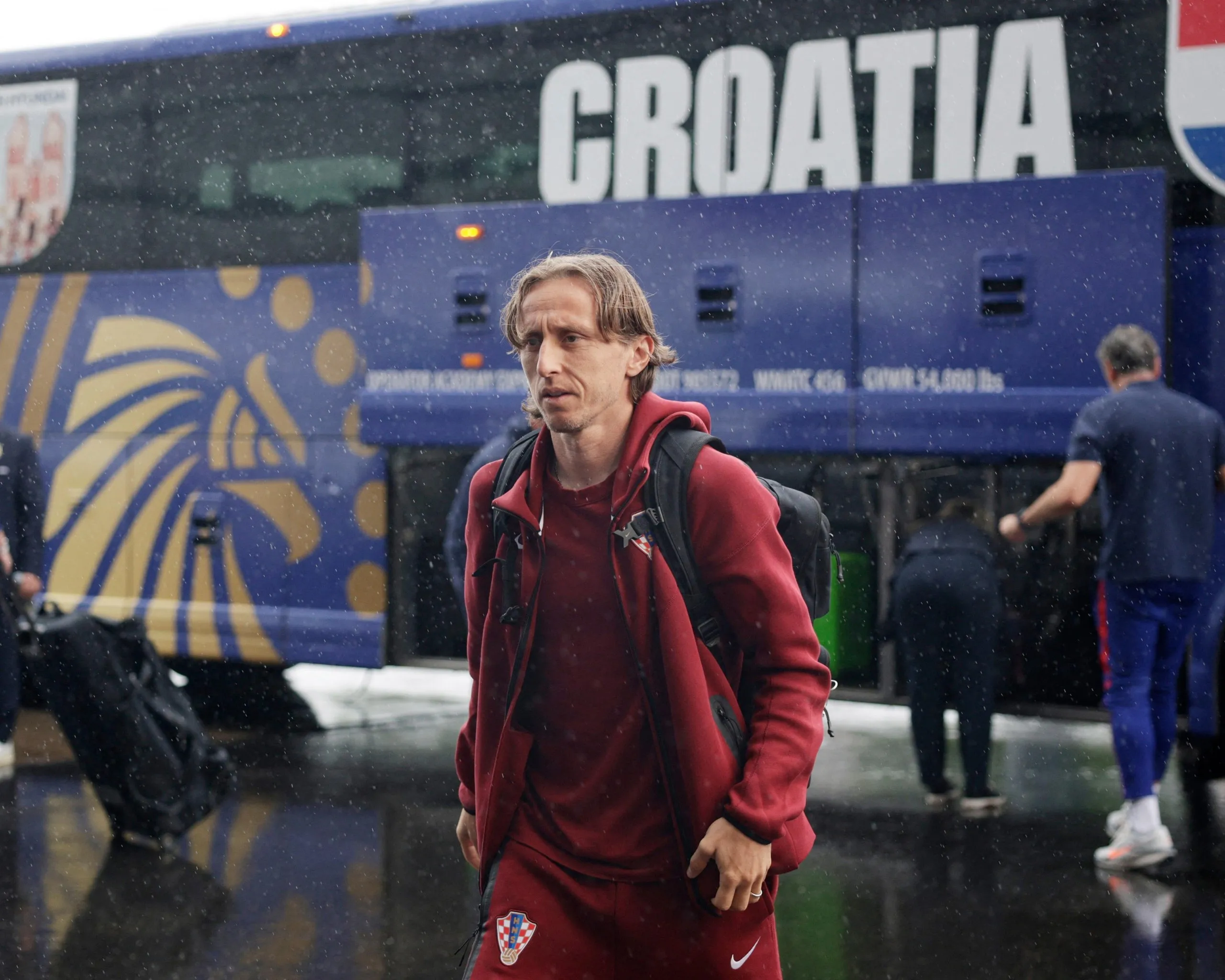Luka Modric walks from the bus to the stadium.