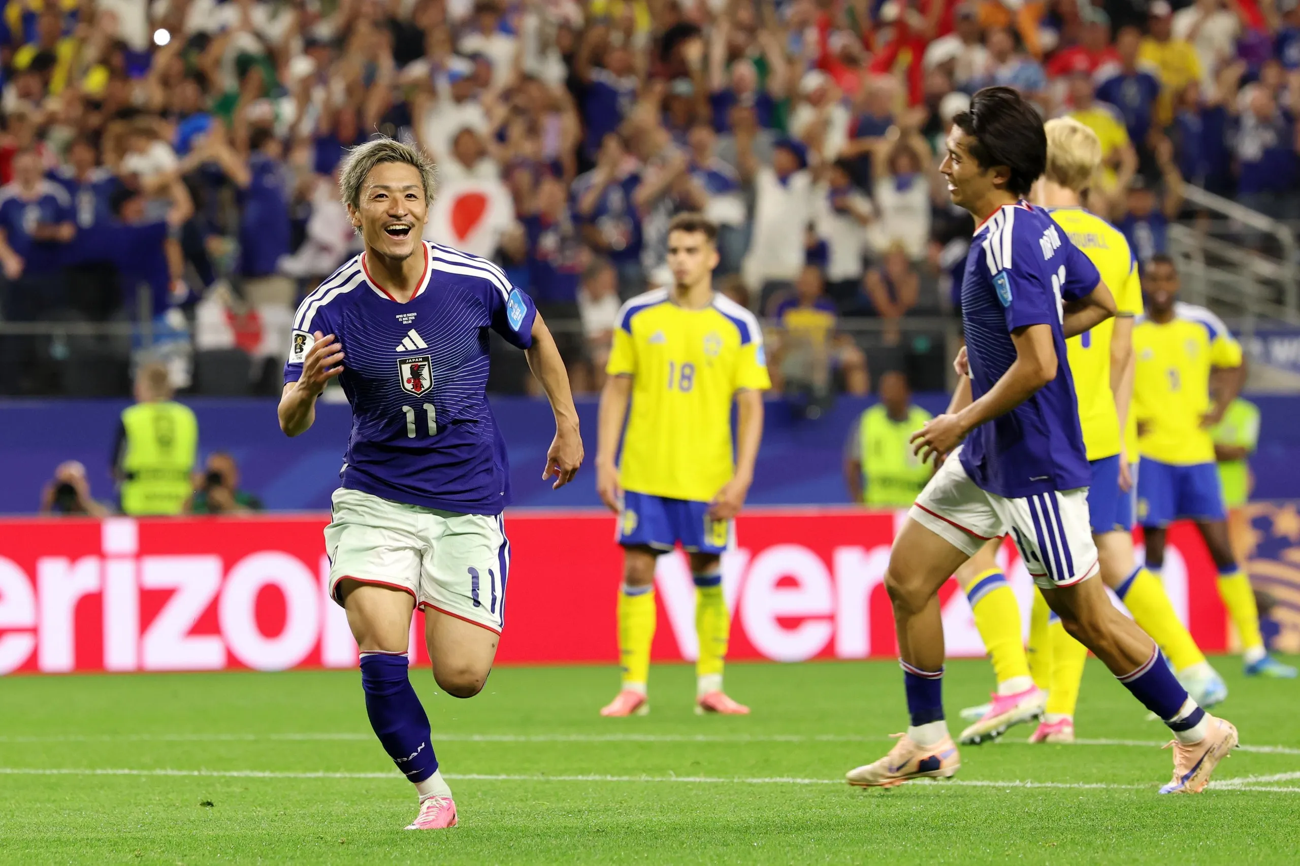 Daizen Maeda celebrates after opening the scoring