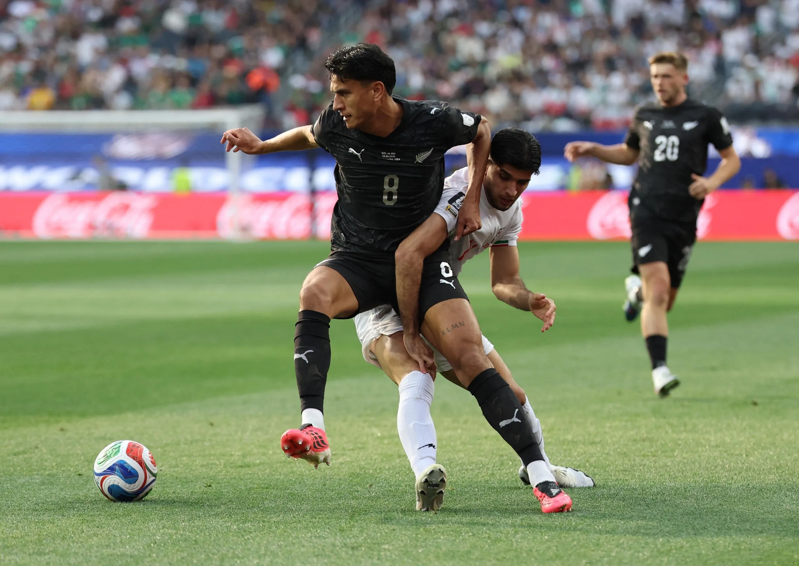 New Zealand's Marko Stamenic in action with Iran's Arya Yousefi