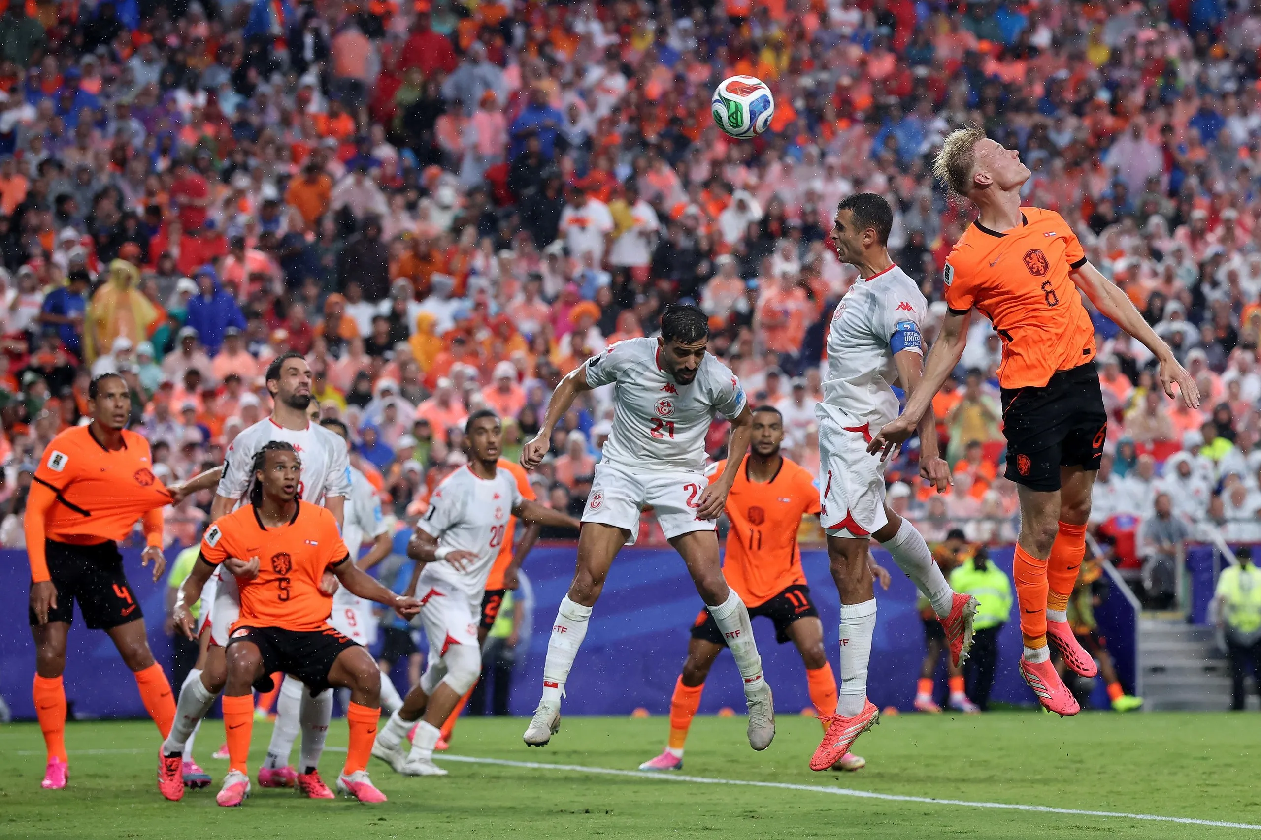 Jan-Paul van Hecke (right) flicks home the Netherlands’ third