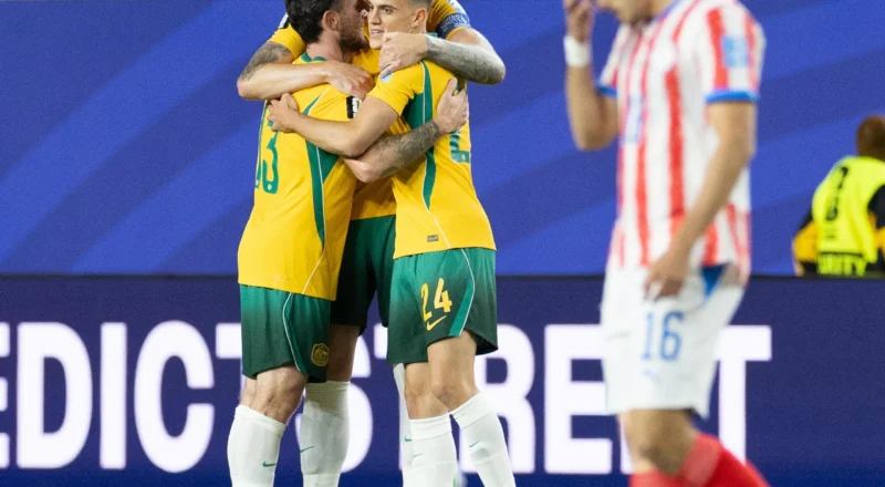 Socceroos secure place in World Cup last 32 after nerve-shredding draw with Paraguay