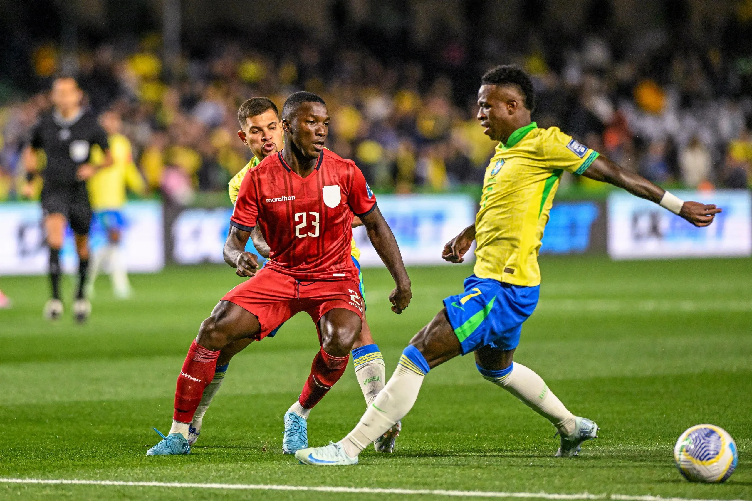 Brazil’s Vinícius Júnior challenges Moisés Caicedo of Ecuador during a World Cup qualifier in Curitiba.