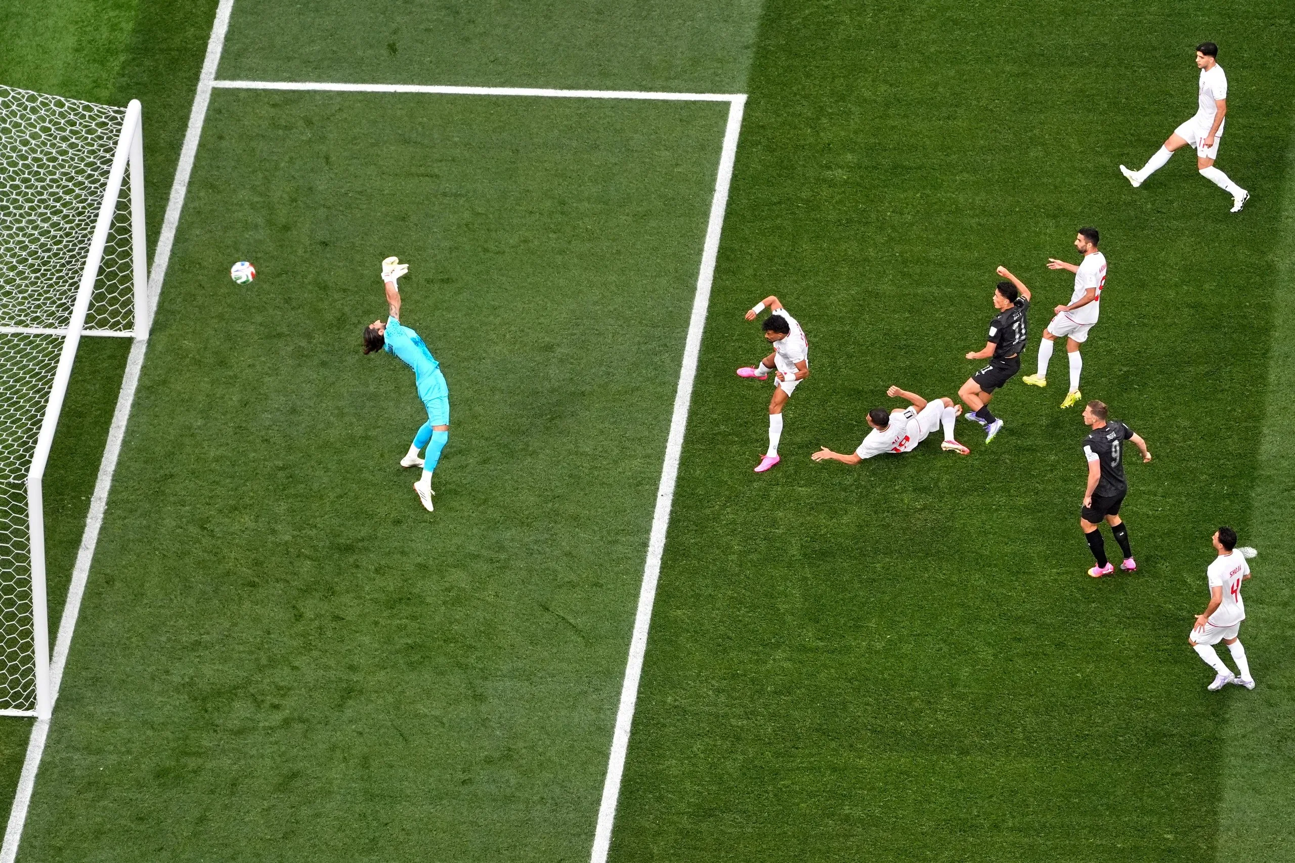 New Zealand’s Elijah Just (11), center, scores their opening goal