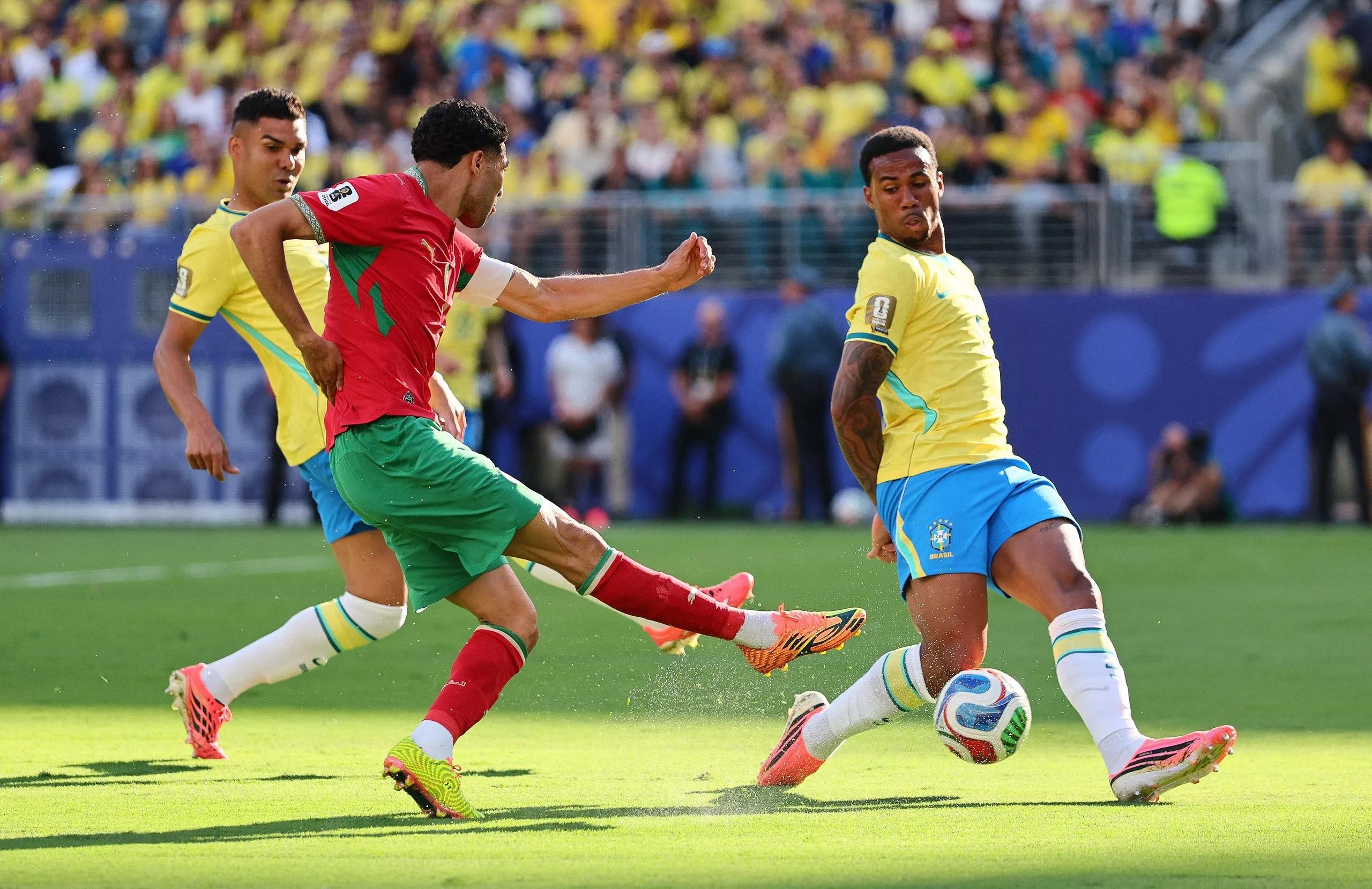Achraf Hakimi in action with Brazil's Gabriel Magalhaes