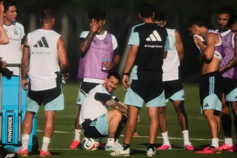 Lionel Messi takes a break with his Argentina teammates during a training session Lionel Messi takes a break with his Argentina teammates during a training session