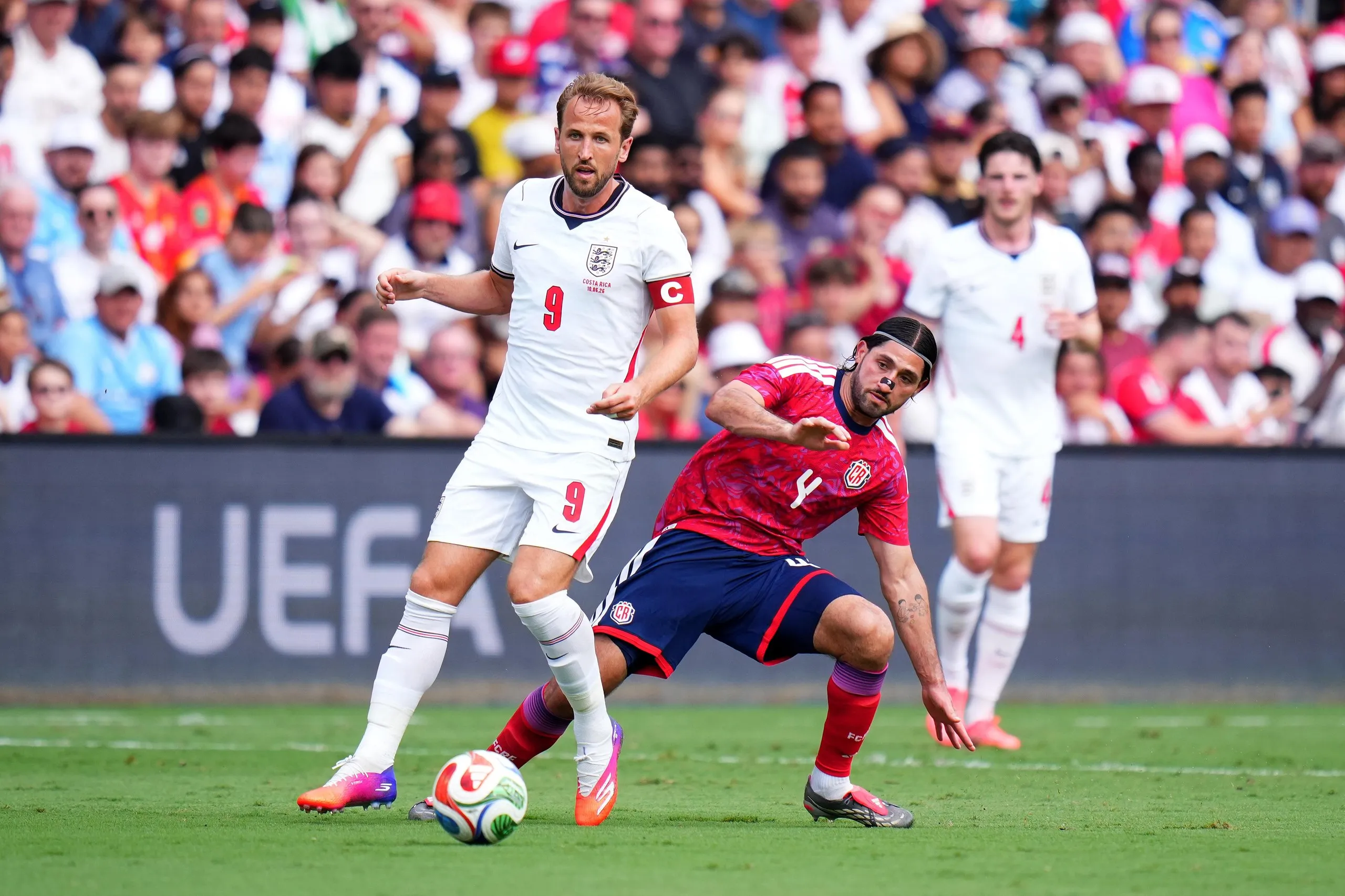 Harry Kane is challenged by Aaron Salazar.