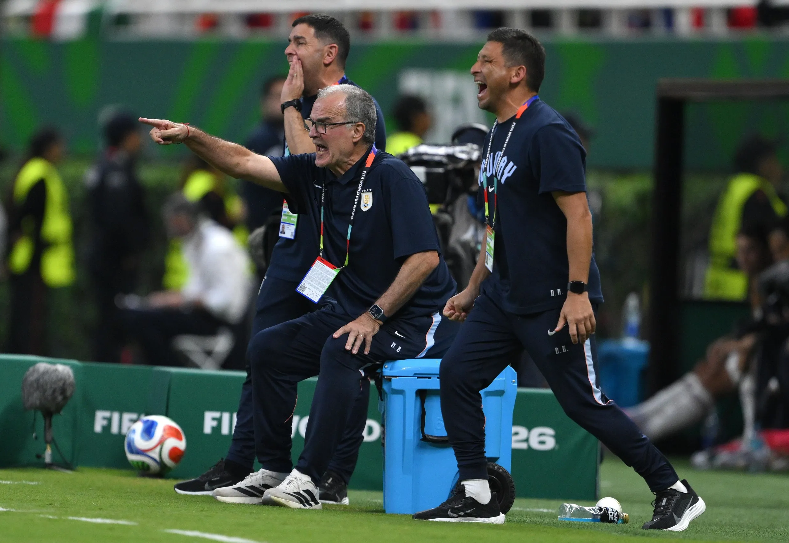 Uruguay head coach Marcelo Bielsa tries to get his point across to his players