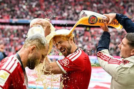 Harry Kane and his Bayern Munich teammates celebrate their Bundesliga win in May Harry Kane and his Bayern Munich teammates celebrate their Bundesliga win in May