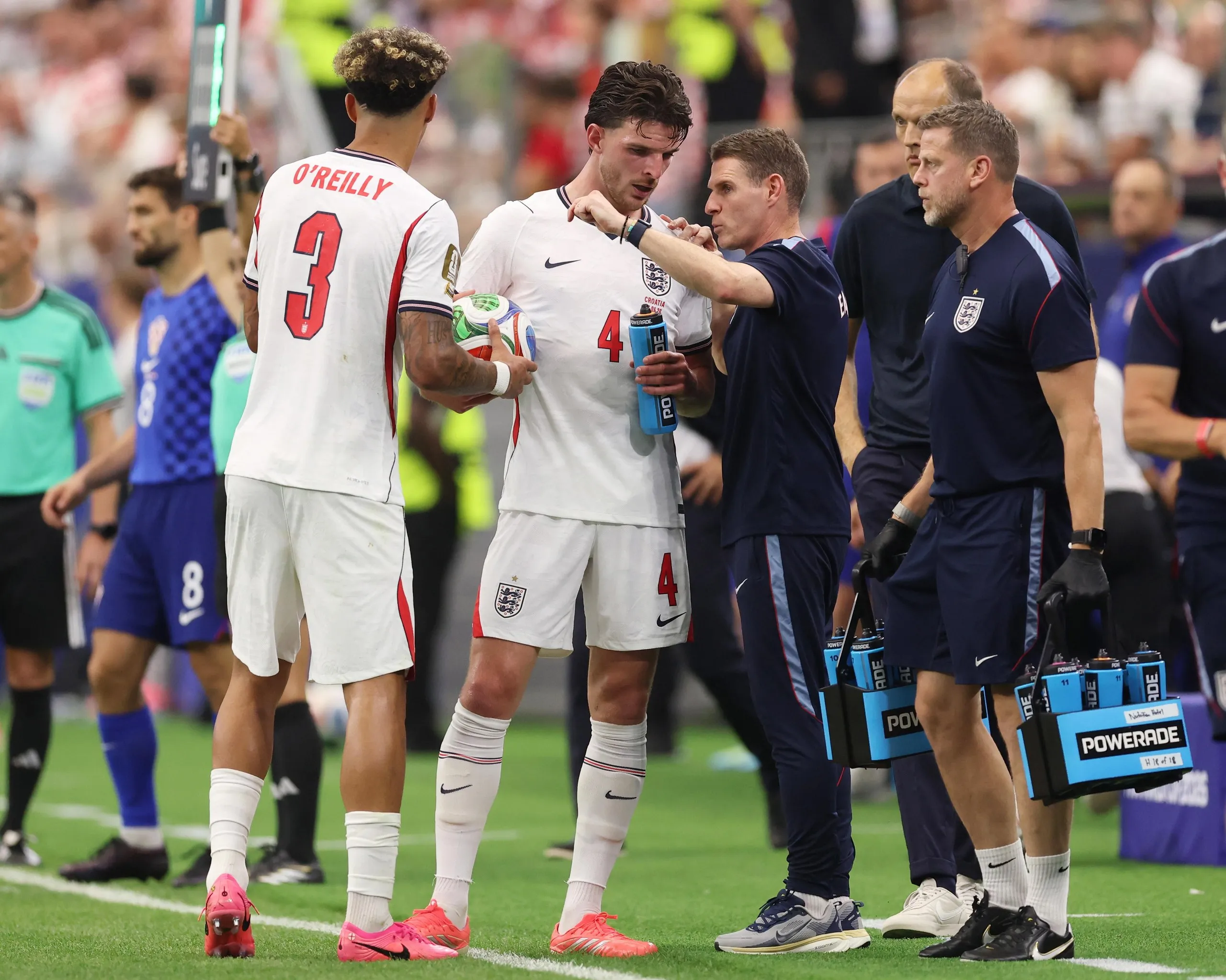 Declan Rice receives instruction from the England assistant manager, Anthony Barry