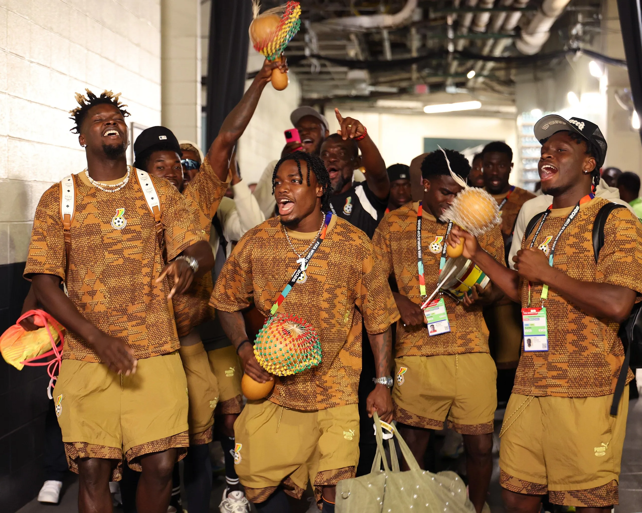 The Ghana squad sing and dance on the way to the changing rooms.
