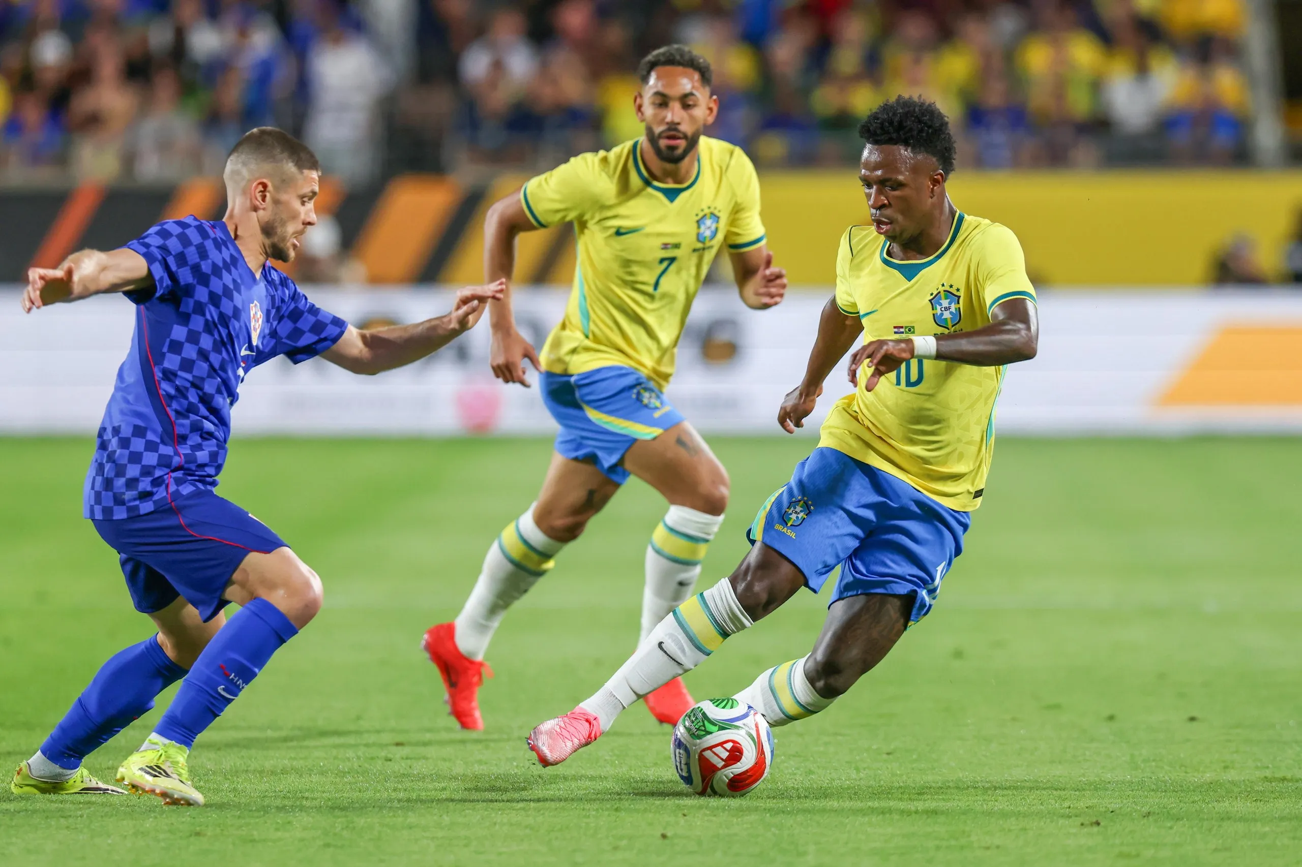 Vinícius Júnior (right) dribbles the ball past Andrej Kramaric during Brazil’s friendly match against Croatia in March