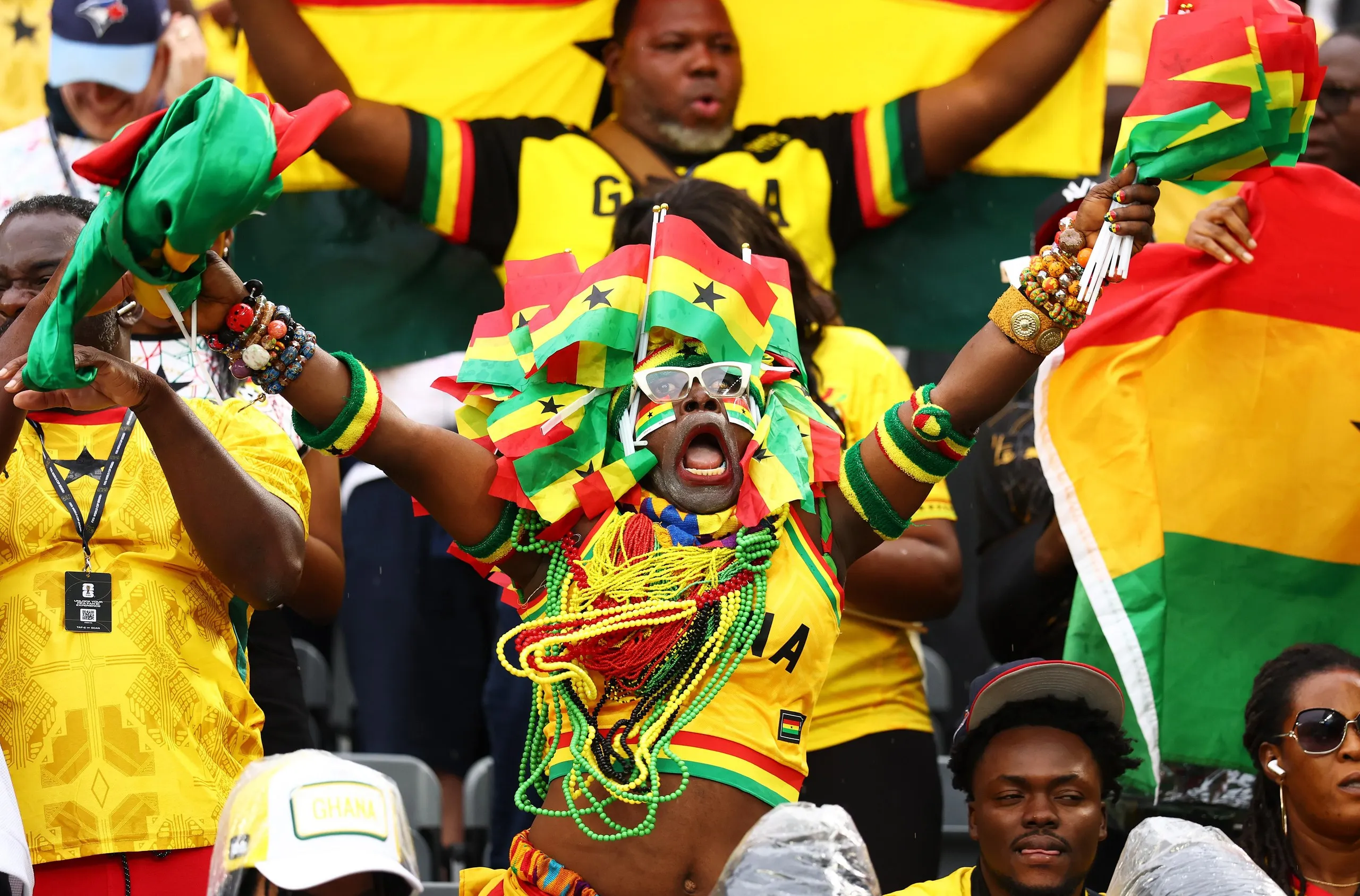A Ghana fan brings in the noise in their match against Panama in Toronto.