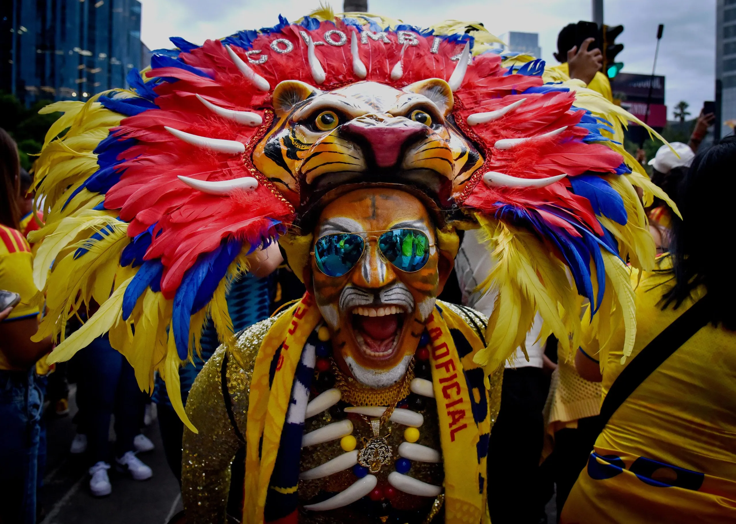 A Colombia fan at the Angel of Independence monument in Mexico City.