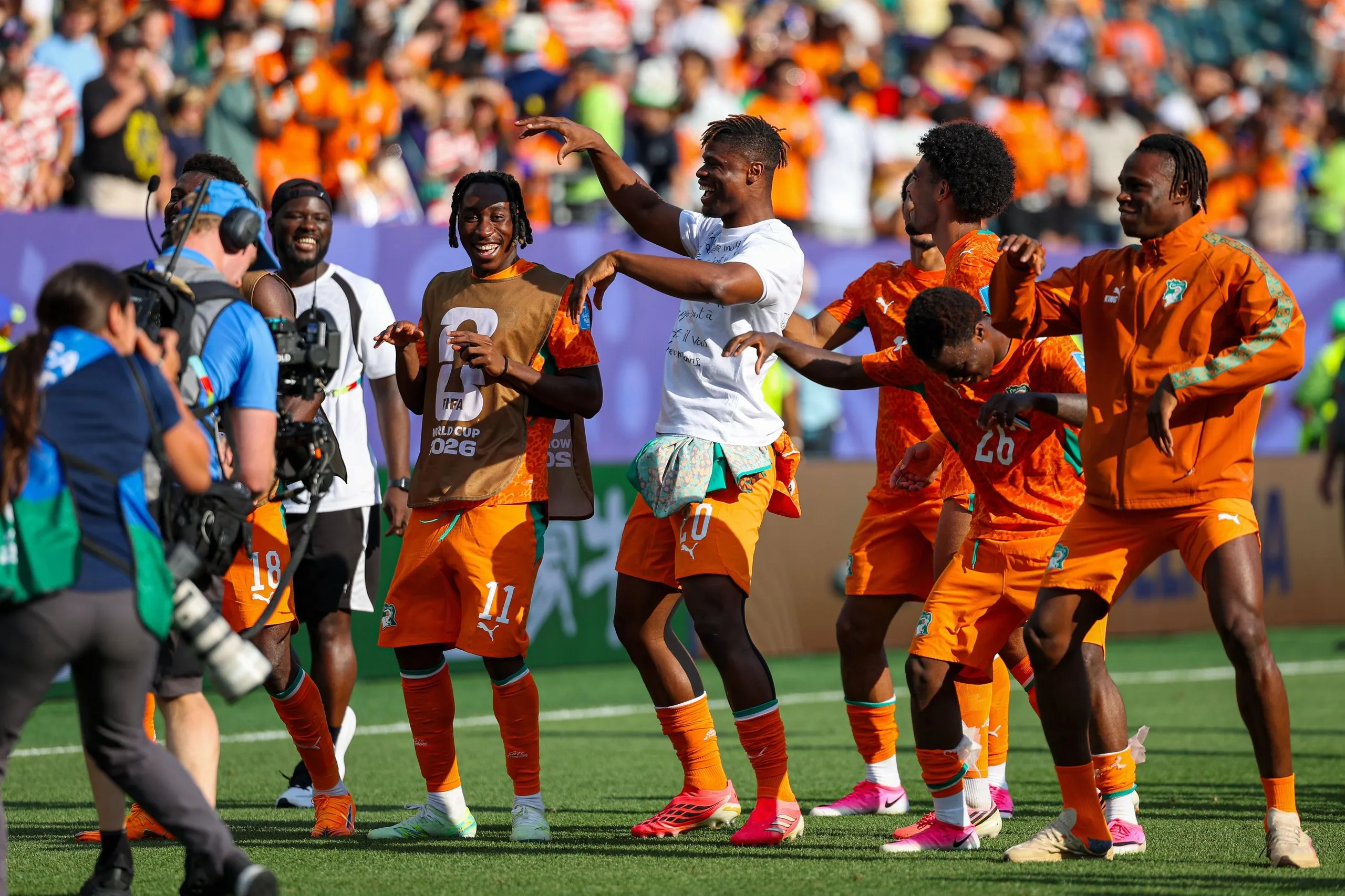 Côte d'Ivoire players celebrate reaching the knockout rounds.