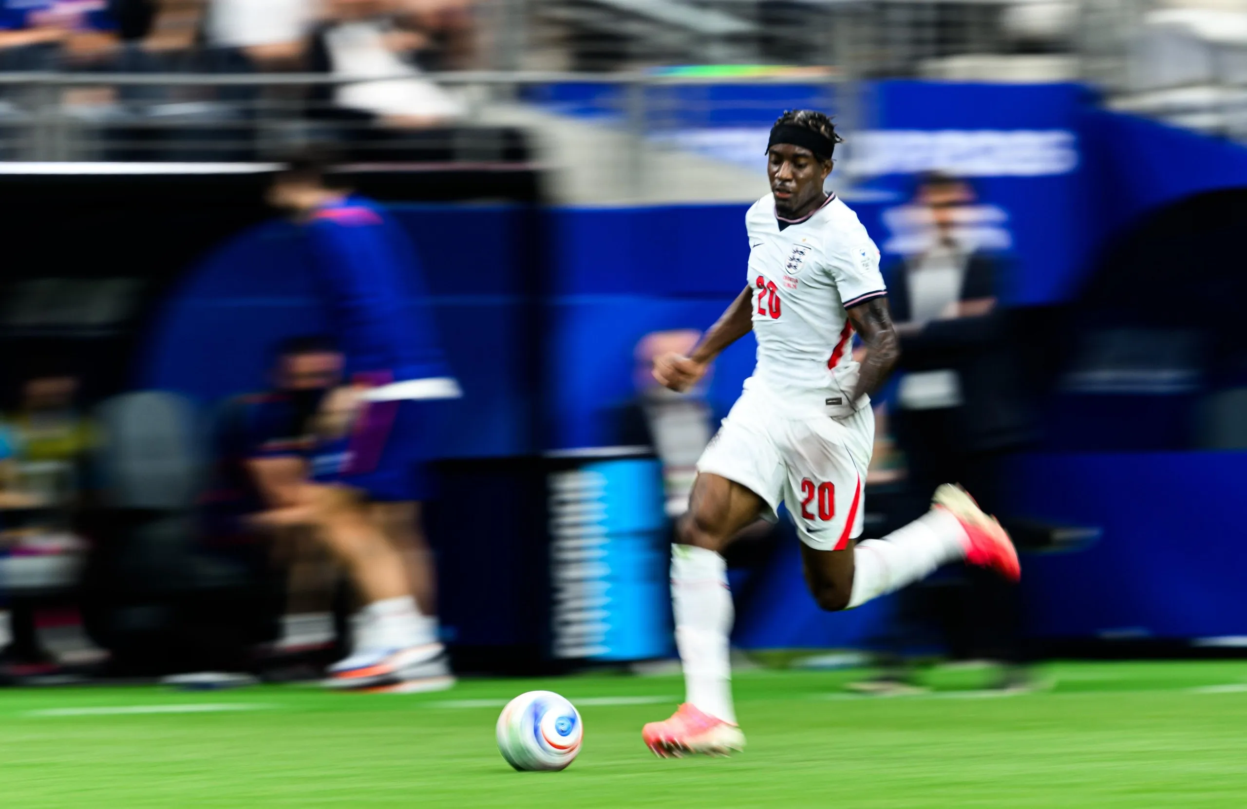 Noni Madueke of England dribbles down the wing against Croatia