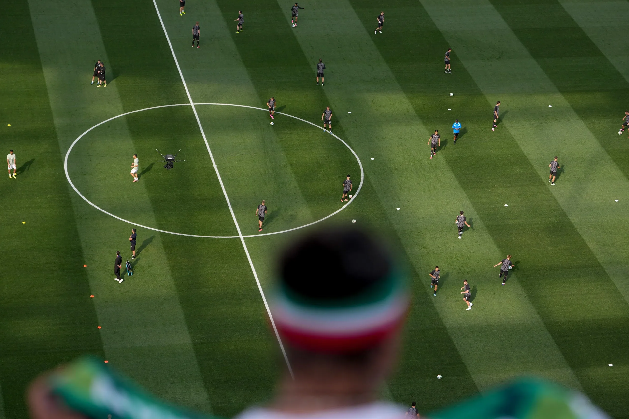 Fans cheer as New Zealand players warm up before the World Cup Group G soccer match between Iran and New Zealand in Inglewood.
