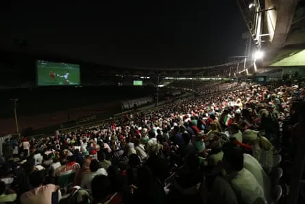 Iranians at Azadi stadium in Tehran watch the 2018 World Cup group game between Portugal and Iran.