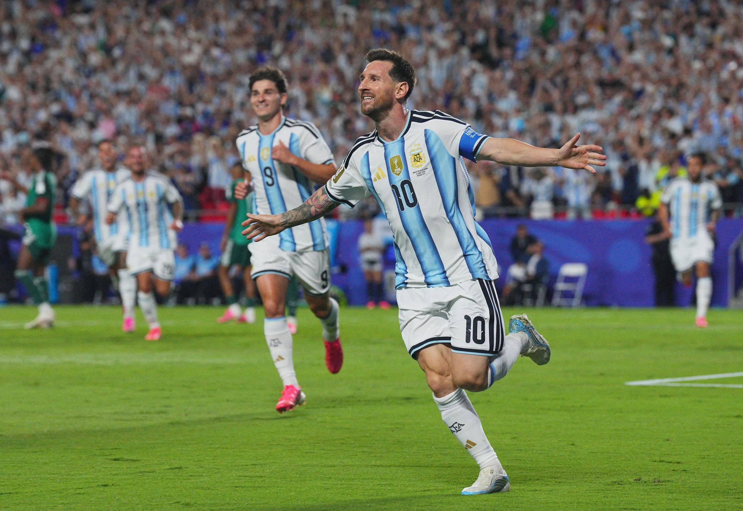 Lionel Messi runs away after scoring