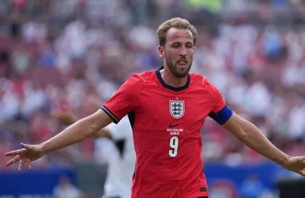Harry Kane runs away from goal after scoring with his arms outstretched