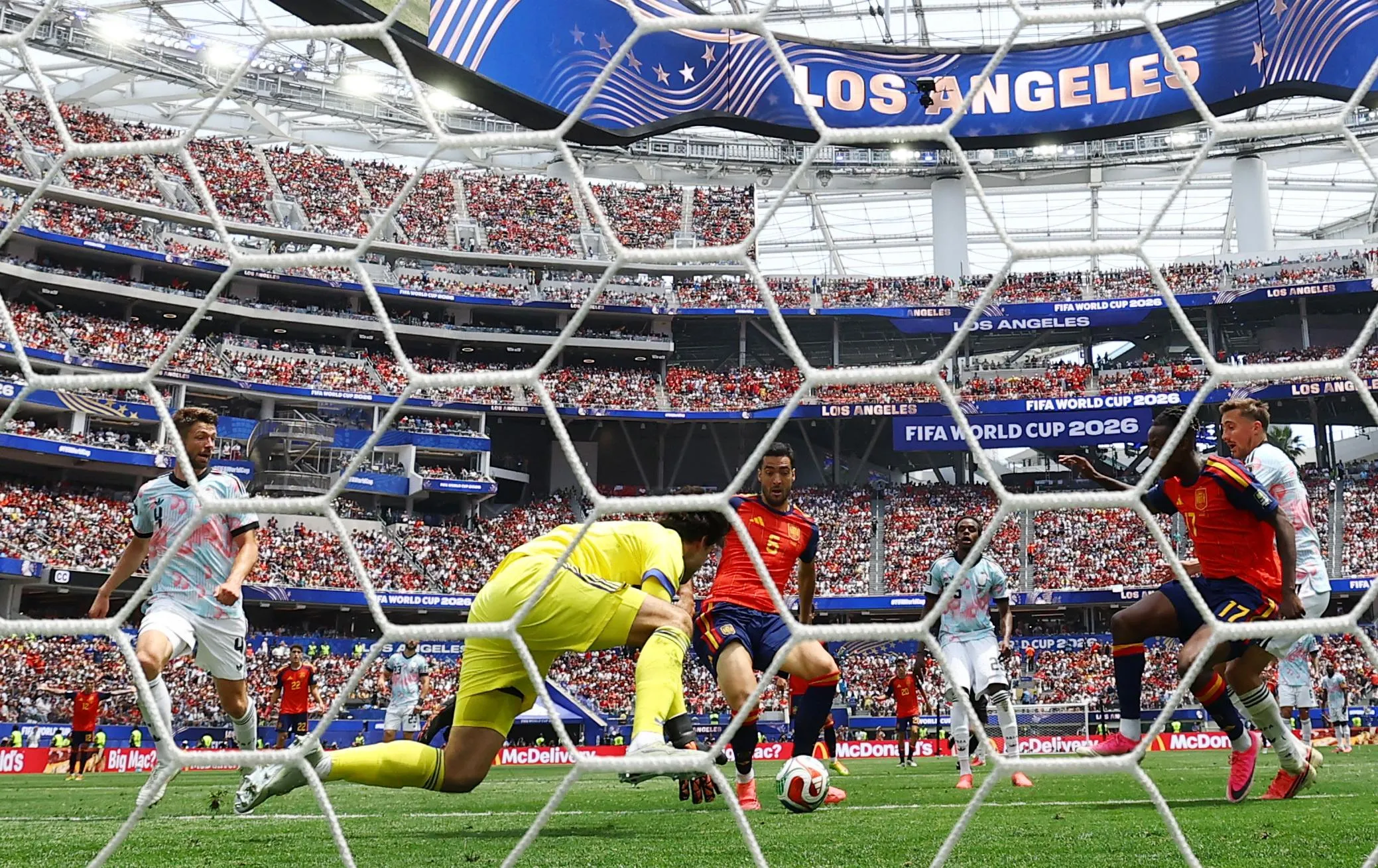 Spain's Mikel Merino scores their second goal past Belgium's substitute keeper Senne Lammens.