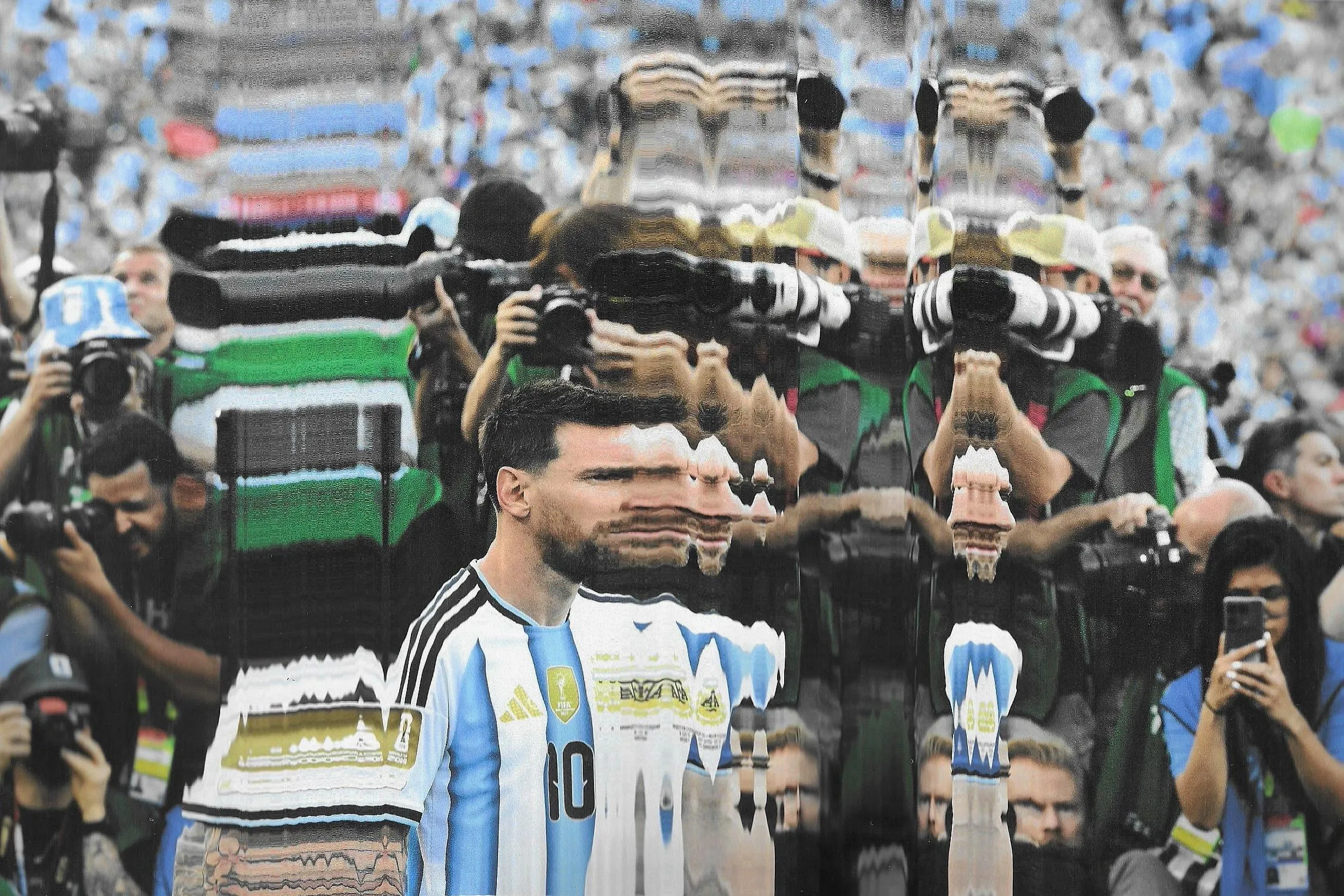 Lionel Messi walks past photographers. Original photograph by Roberto Schmidt.