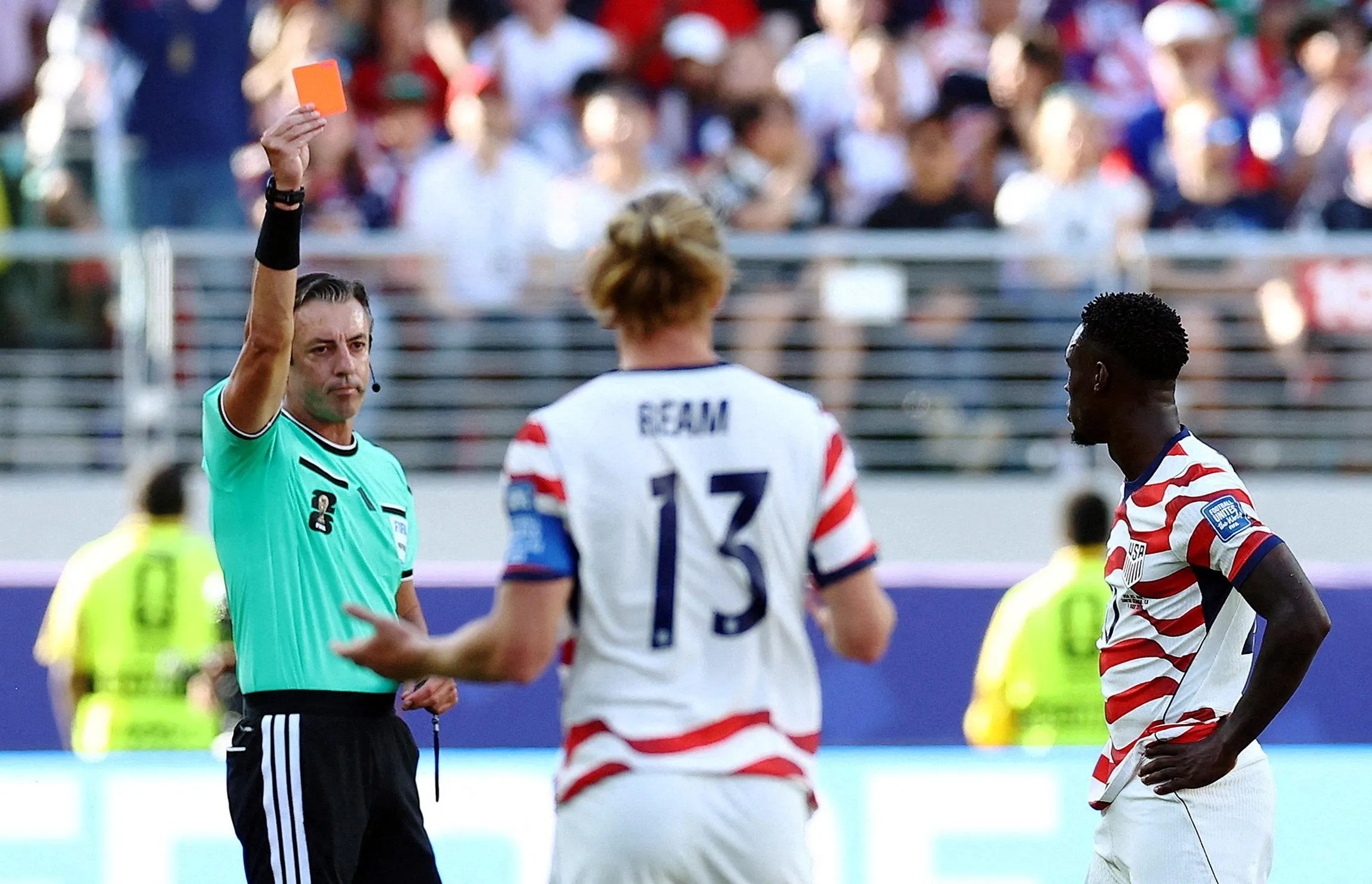 The USA’s Folarin Balogun is shown a red card by the referee Raphael Claus