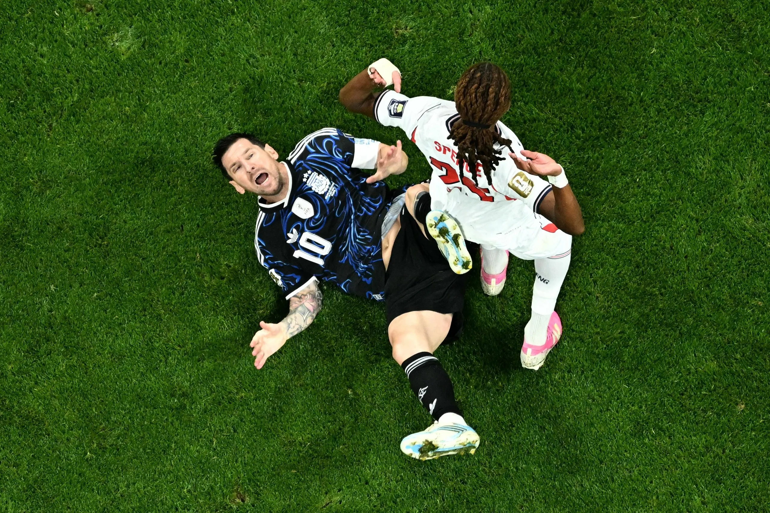 Djed Spence leaves Lionel Messi on the pitch after a tackle in the semi-final