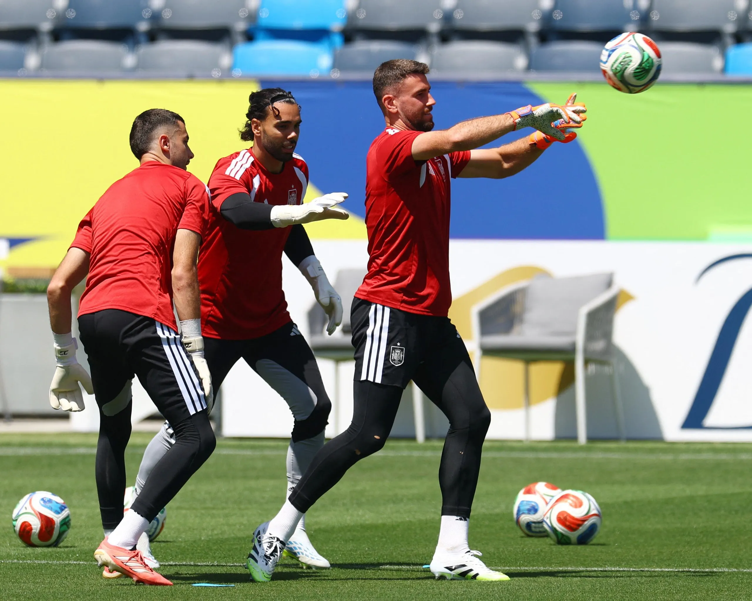 The Spain goalkeepers Unai Simón, David Raya and Joan García train ahead of their team's 2026 World Cup quarter-final against Belgium.