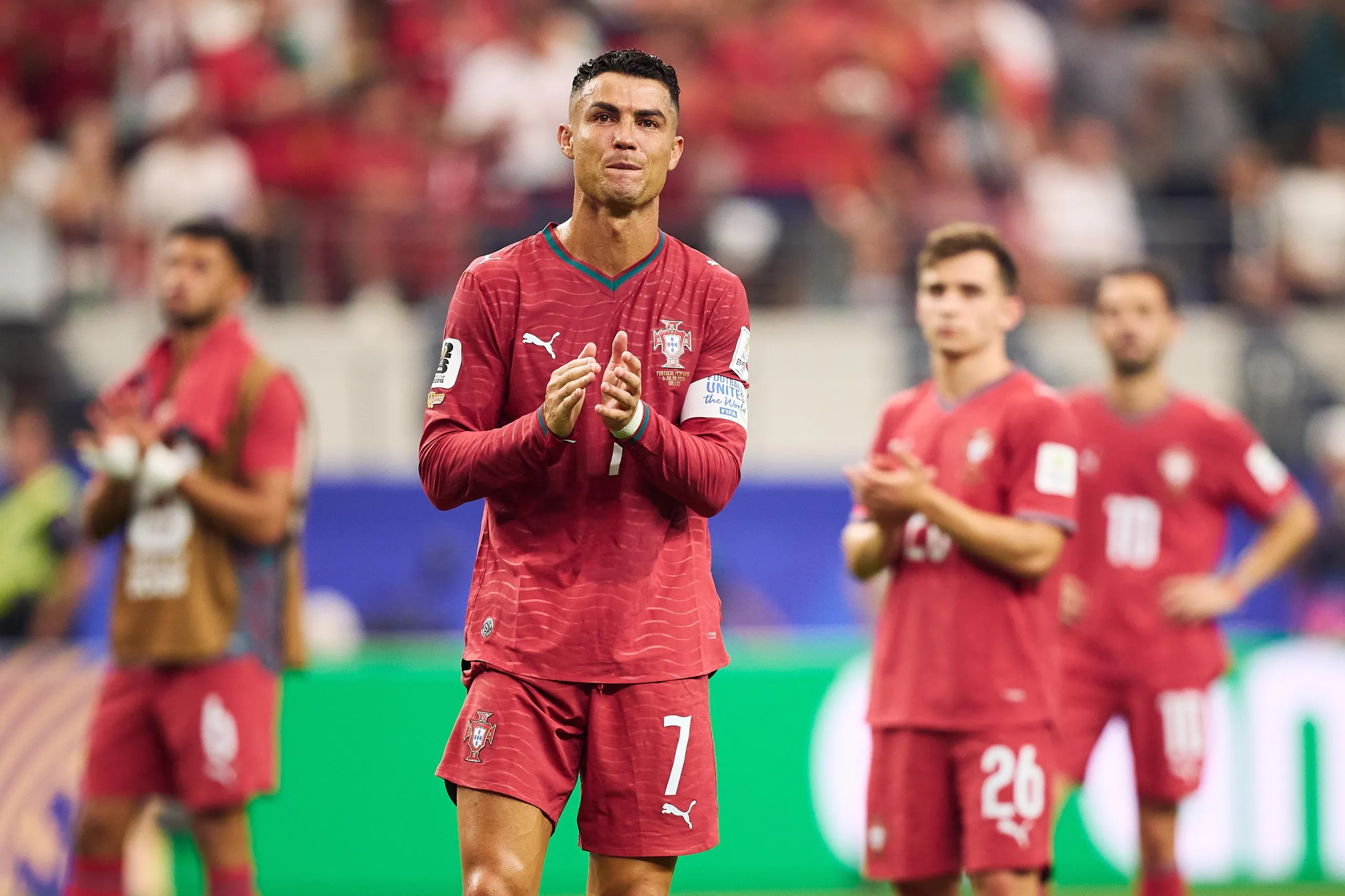 Cristiano Ronaldo of Portugal applauds the fans after defeat by Spain.