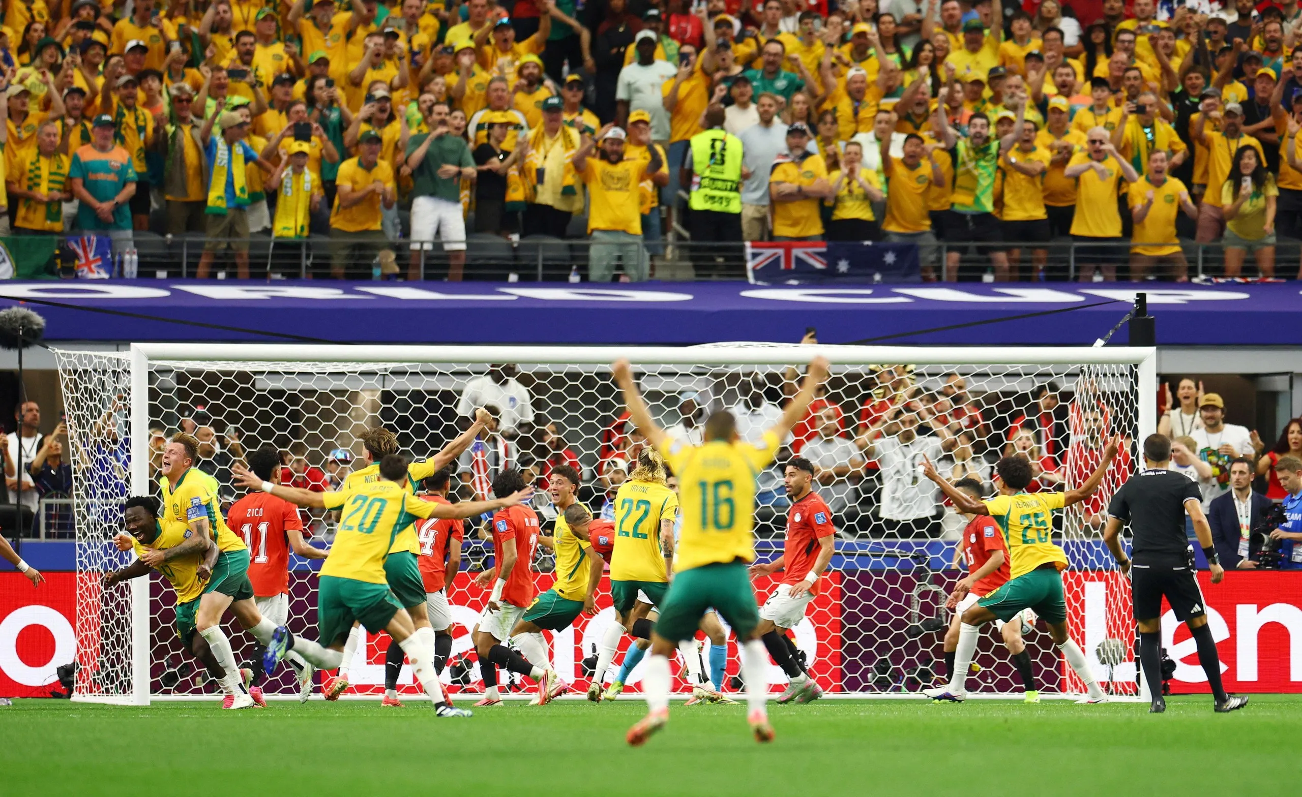 Australia’s Harry Souttar and Nestory Irankunda celebrate after Egypt’s Mohamed Hany scored an own goal.