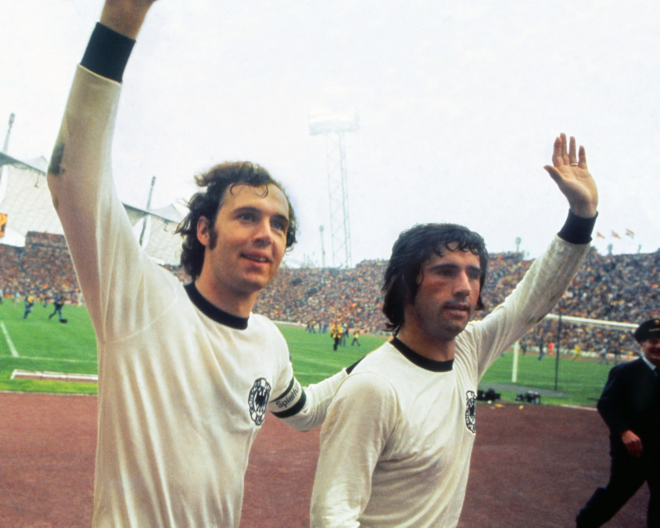 West Germany captain Franz Beckenbauer celebrates with teammate Gerd Müller after their win in Munich in the 1974 World Cup final