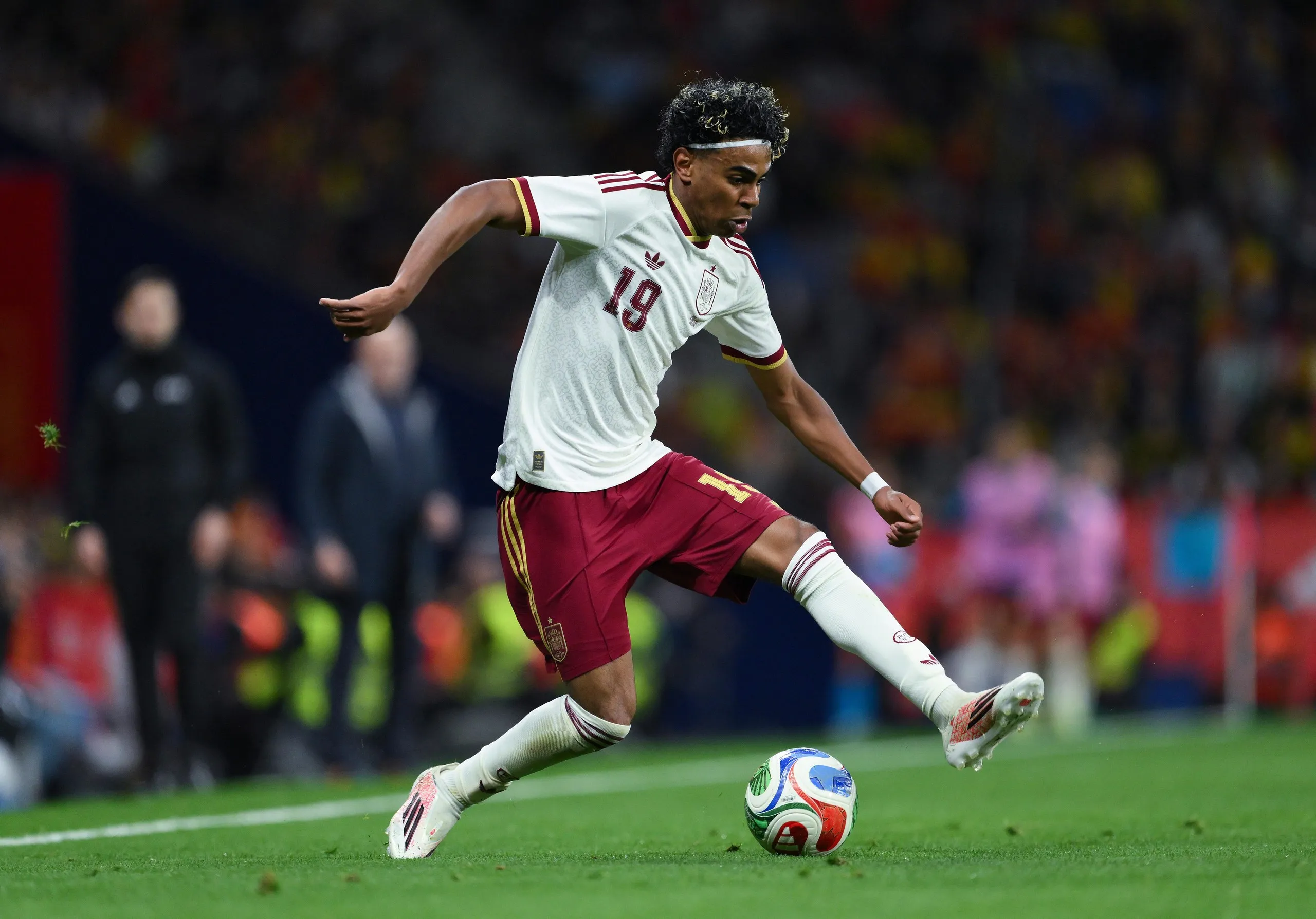 Spain’s Lamine Yamal runs with the ball during an international friendly match against Egypt
