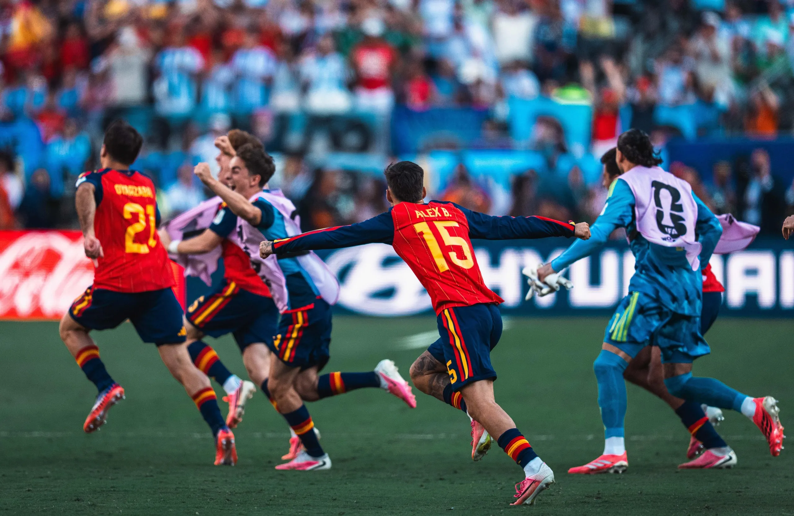 Spain’s substitutes run onto the pitch in celebration as the final whistle blows in Sunday’s World Cup final